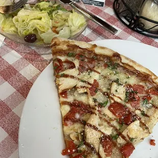 BBQ chicken pizza slice and side salad