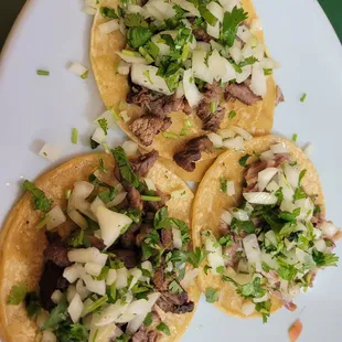 three tacos on a plate