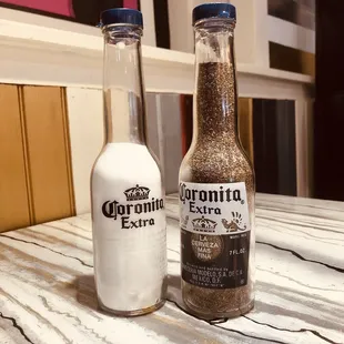 a bottle of coronantia extra and a bottle of coronantia extra