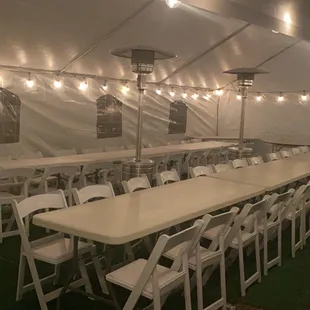 20x40 ; White Padded Resin Chairs ; 8ft Rectangle Tables ; Lighting ; Heaters