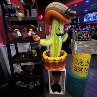 a cactus with a hat and a banana