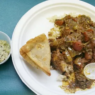 Homemade samosa, chicken curry and fresh coconut chutney