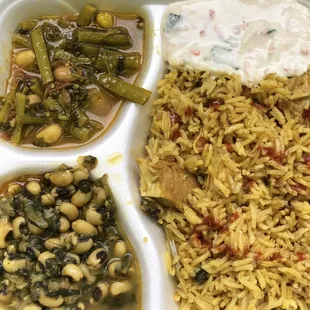 Friday special - chicken biryani with raita, black-eyed &amp; spinach, green beans with peanuts. So good