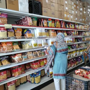a woman shopping in a grocery store