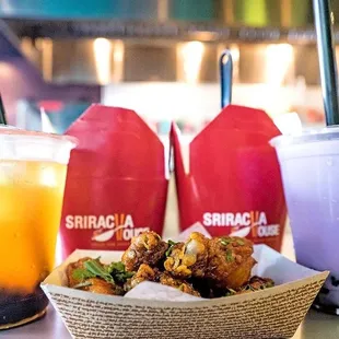 a basket of fried food and drinks