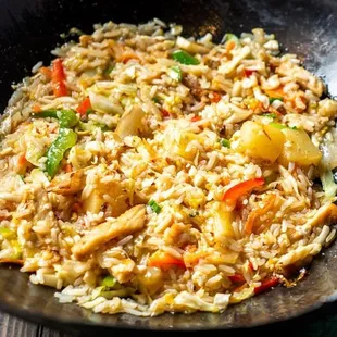 fried rice with vegetables in a wok