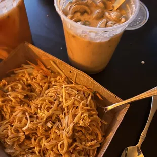 a plate of noodles and a drink