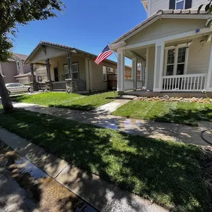 a house with a flag in the front yard