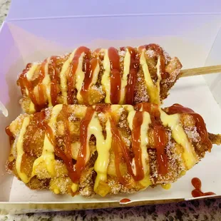 Two delicious potato mozzarella sausage hot dogs