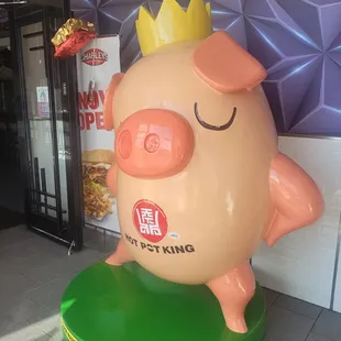 a pig with a crown on its head