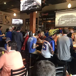 a large group of people sitting at tables