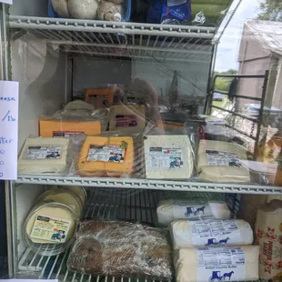 shelves of cheese and bread