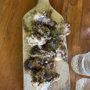 a cutting board with meat on it