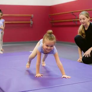 Young acro dancer with teacher