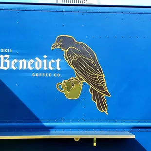 a bird on a coffee cup