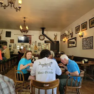a group of people sitting around a table