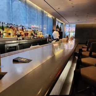 a bar with a view of the city