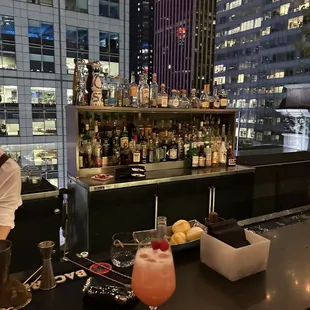 a view of a bar with cocktails