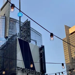 a street light with a building in the background