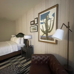 a hotel room with two beds and a couch