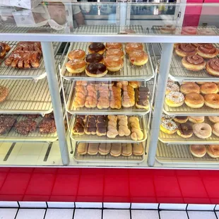 a display case filled with donuts