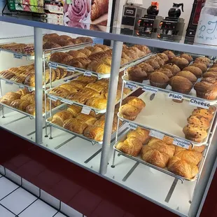 a display case filled with baked goods