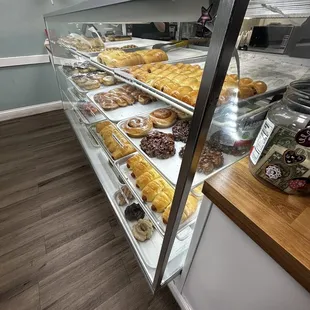 a display case filled with various types of donuts