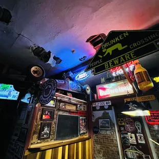 a pool table and neon signs