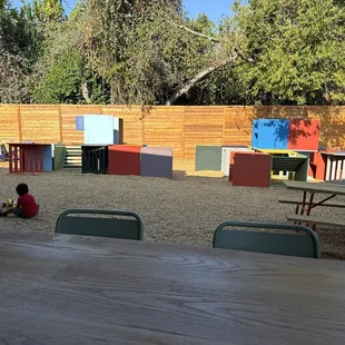 Kids play area with seating and shade