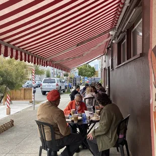 a group of people sitting at a table