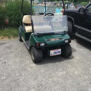 a golf cart parked in a parking lot