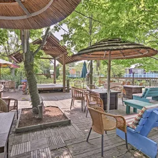 a patio with tables and umbrellas