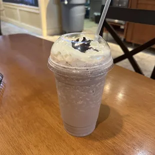 a smoothie in a plastic cup