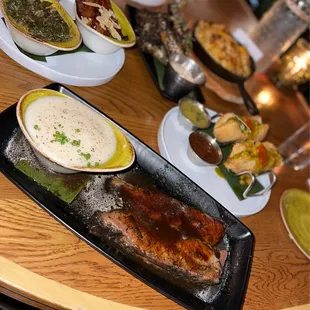 jerk brisket (12hr smoked and marinated) served with whipped cassava, in foreground.
