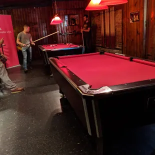 Pool room, two tables and a couple video games