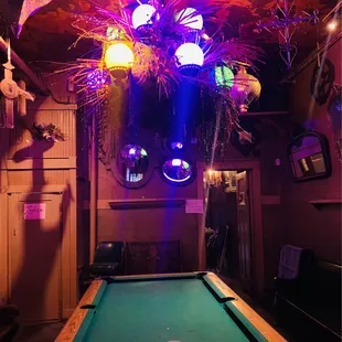 a pool table with a green cloth