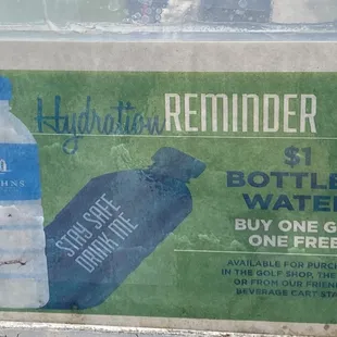 The sign on the inside of St. John's golf carts reminding people to "stay safe" by staying hydrated - what a joke!