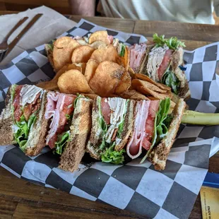 Club sandwich on rye with homemade potato chips.