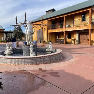 a fountain in front of a building