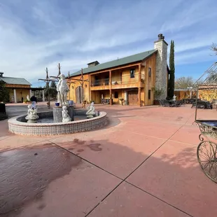 a horse drawn carriage in front of the winery