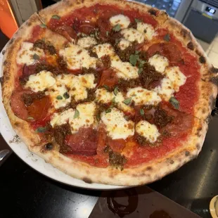 Pepperoni and sausage pizza with hot honey added.