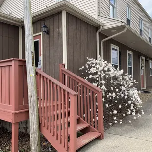 This is what the building looks like. I could find no sign. It's across the street from the church.