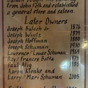 Sign hanging in Tavern of owner history.