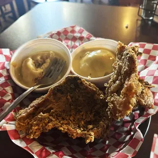 Friend chicken breast with side of mashed potatoes and gravy.