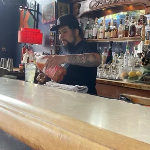 Bartender prepares my drink