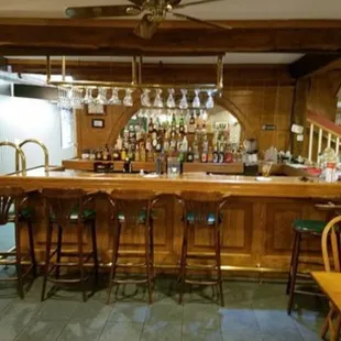 a bar with a ceiling fan