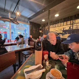 The restaurant has a fishing shack in the woods vibe - including a plane that hangs from the ceiling