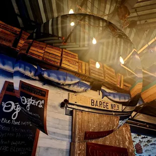 a wooden boat hanging from the ceiling