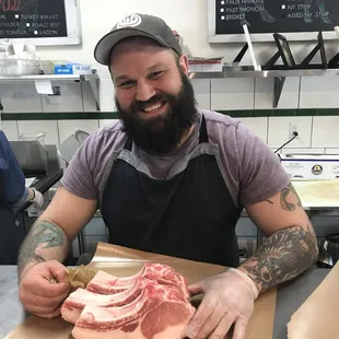a man holding a piece of meat