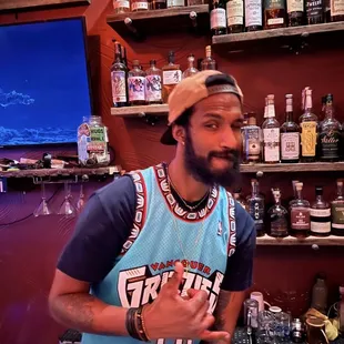 a man with a beard in a jersey